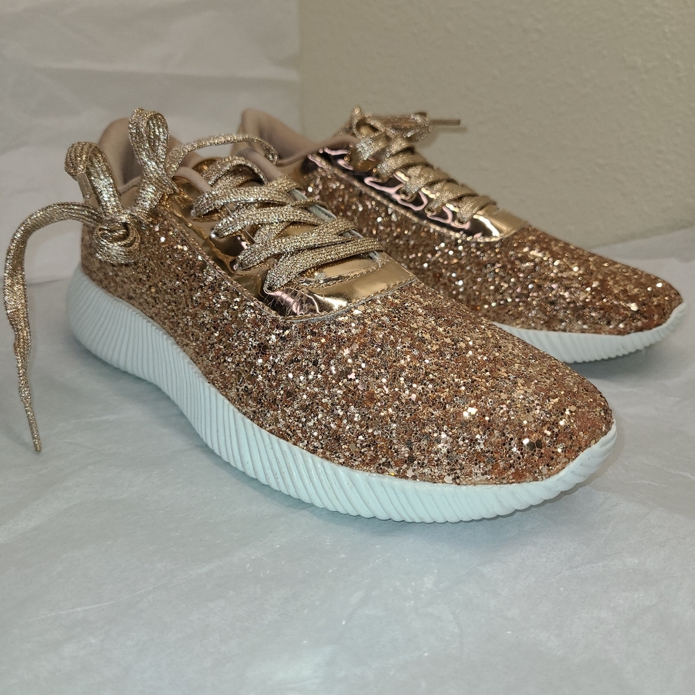 Rose gold glitter sneakers.